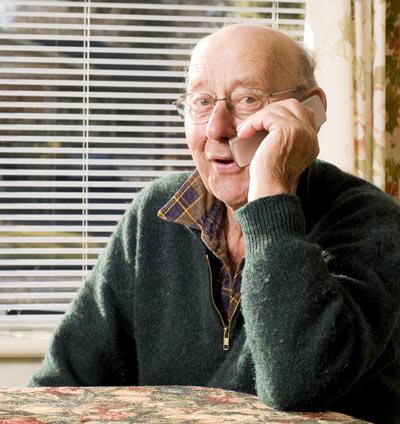 Elderly man talking on phone